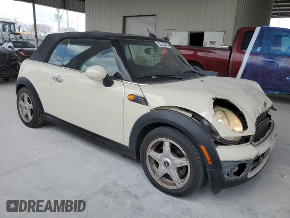 2010 MINI Convertible with VIN WMWMR3C59ATU98597, listed as a Copart auction lot 53336025 with 88,273 mi miles and Salvage Title. Bid and sale history available at DreamBid. Image 4.