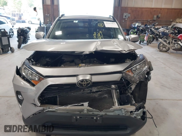 2021 Toyota RAV4 XLE with VIN 2T3P1RFV5MC180890, listed as a IAAI auction lot 42567858 with 56,961 mi miles and . Bid and sale history available at DreamBid. Image 6.