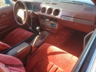 1983 Datsun 280ZX z VIN JN1HZ04S0DX560086, wystawiony jako Copart lot #79178604 z przebiegiem 183 309 mil mil oraz Szkody całkowita. Historia ofert i sprzedaży dostępna na DreamBid. Obrazek 8.