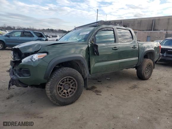 2022 Toyota Tacoma 4WD SR with VIN 3TMCZ5AN1NM483304, listed as a Copart auction lot 85561014 with 87,953 mi miles and Salvage Title. Bid and sale history available at carsss.com. Image 1.