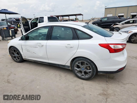 2013 Ford Focus SE with VIN 1FADP3F20DL289978, listed as a Copart auction lot 63350585 with 211,677 mi miles and Salvage title. Bid and sale history available at DreamBid. Image 2.