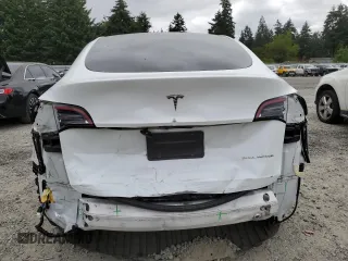 2023 Tesla Model Y Long Range z VIN 7SAYGDEE9PA081604, wystawiony jako Copart lot #60163785 z przebiegiem 42 134 mil mil oraz Szkoda całkowita • Salvage title. Historia ofert i sprzedaży dostępna na DreamBid. Obrazek 6.