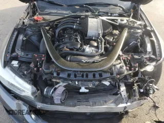 2016 BMW M4 with VIN WBS3R9C5XGK337197, listed as a Copart auction lot 87056764 with 110,398 mi miles and Salvage title. Bid and sale history available at DreamBid. Image 11.