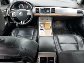 2010 Jaguar XF Supercharged with VIN SAJWA0HE1AMR74203, listed as a Copart auction lot 64029824 with 128,676 mi miles and Salvage Title. Bid and sale history available at carsss.com. Image 8.