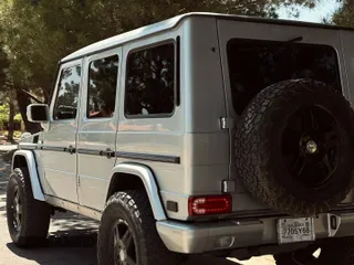 2002 Mercedes-Benz G 500 with VIN WDCYR49EX2X128555, listed as a Copart auction lot 55605995 with 225,042 mi miles and Salvage Title. Bid and sale history available at DreamBid. Image 3.