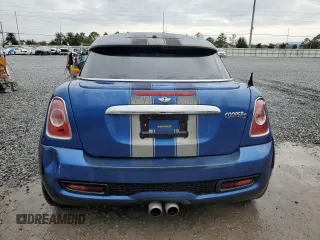 2014 MINI Coupe S z VIN WMWSX3C59ET772948, wystawiony jako Copart lot #81220834 z przebiegiem 99 211 mil mil oraz Szkody całkowita. Historia ofert i sprzedaży dostępna na DreamBid. Obrazek 6.