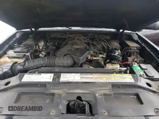 2001 Ford Explorer Sport z VIN 1FMYU60E11UC18170, wystawiony jako Copart lot #49212385 z przebiegiem 219 383 mil mil oraz Tytuł czysty. Historia ofert i sprzedaży dostępna na DreamBid. Obrazek 11.