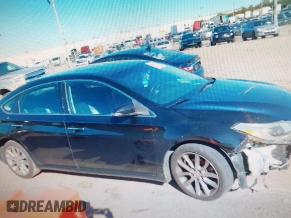 2014 Toyota Avalon Limited with VIN 4T1BK1EB4EU096164, listed as a IAAI auction lot 40904808 with 242,086 mi miles. Bid and sale history available at carsss.com. Image 12.