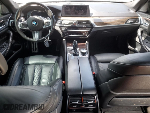 2018 BMW 5 Series M550i xDrive with VIN WBAJB9C57JB286734, listed as a Copart auction lot 52711235 with 127,450 mi miles and Salvage title. Bid and sale history available at DreamBid. Image 8.