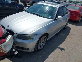 2011 BMW 3 Series 328i with VIN WBAPH7G57BNM58073, listed as a IAAI auction lot 41883231 with 144,539 mi miles. Bid and sale history available at carsss.com. Image 2.