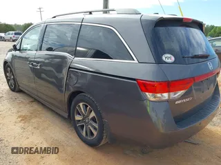 2015 Honda Odyssey Touring Elite z VIN 5FNRL5H97FB060981, wystawiony jako IAAI lot #42289631 z przebiegiem 160 947 mil mil oraz . Historia ofert i sprzedaży dostępna na DreamBid. Obrazek 3.