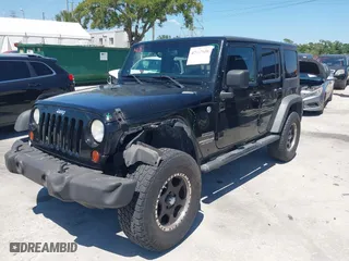 2013 Jeep Wrangler Unlimited Sport with VIN 1C4BJWDG7DL583686, listed as a IAAI auction lot 42037650 with 122,408 mi miles. Bid and sale history available at carsss.com. Image 2.