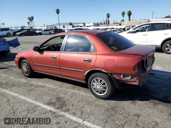 1998 Mazda Protege DX z VIN JM1BC1411W0198007, wystawiony jako Copart lot #46941185 z przebiegiem 101 696 mil mil oraz Szkoda całkowita • Salvage title. Historia ofert i sprzedaży dostępna na DreamBid. Obrazek 2.