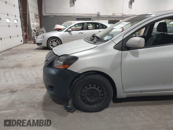 2008 Toyota Yaris with VIN JTDBT903781251568, listed as a IAAI auction lot 42090260 with 264,356 mi miles. Bid and sale history available at carsss.com. Image 11.