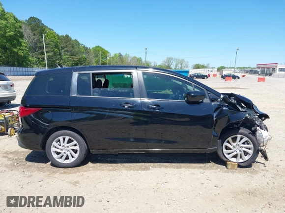 2012 Mazda 5 Sport with VIN JM1CW2BL4C0104669, listed as a IAAI auction lot 42048877 with 115,660 mi miles and . Bid and sale history available at DreamBid. Image 14.