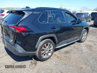 2021 Toyota RAV4 XLE Premium with VIN 2T3A1RFV6MC236809, listed as a IAAI auction lot 42056379 with 99,921 mi miles and . Bid and sale history available at DreamBid. Image 4.