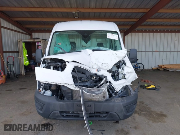 2024 Ford Transit Cargo with VIN 1FTBR1C83RKA91627, listed as a IAAI auction lot 41455595 with 12,010 mi miles and . Bid and sale history available at DreamBid. Image 13.