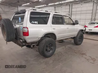 1998 Toyota 4Runner SR5 with VIN JT3HN86R1W0180174, listed as a IAAI auction lot 42065817 with 252,961 mi miles and . Bid and sale history available at DreamBid. Image 4.