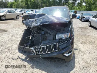 2018 Jeep Grand Cherokee Laredo E with VIN 1C4RJEAG1JC354221, listed as a Copart auction lot 58002715 with 108,223 mi miles and Salvage title. Bid and sale history available at DreamBid. Image 5.
