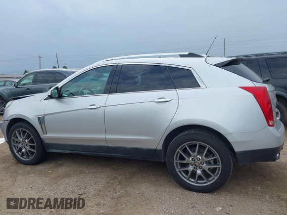 2015 Cadillac SRX Performance Collection z VIN 3GYFNCE36FS633386, wystawiony jako IAAI lot #41851338 z przebiegiem 102 586 mil mil oraz . Historia ofert i sprzedaży dostępna na DreamBid. Obrazek 14.