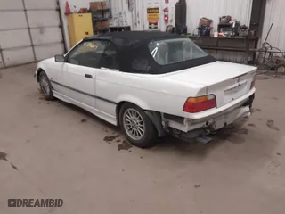 1997 BMW 3-Series 328IC with VIN WBABK832XVET95942, listed as a IAAI auction lot 41246303 with 165,825 mi miles. Bid and sale history available at carsss.com. Image 3.
