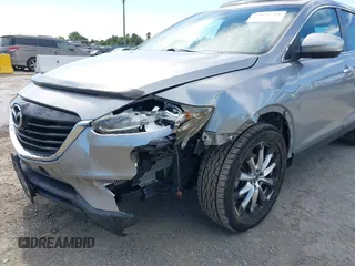 2014 Mazda CX-9 Grand Touring z VIN JM3TB2DVXE0432991, wystawiony jako IAAI lot #42826784 z przebiegiem 134 265 mil mil oraz . Historia ofert i sprzedaży dostępna na DreamBid. Obrazek 6.