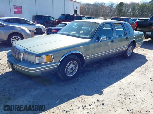 1994 Lincoln Town Car Signature z VIN 1LNLM82W4RY785151, wystawiony jako IAAI lot #41638398 z przebiegiem Nie podano mil oraz . Historia ofert i sprzedaży dostępna na DreamBid. Obrazek 2.