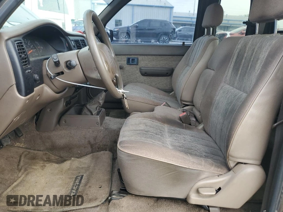 1999 Toyota Tacoma with VIN 4TAVL52N8XZ561633, listed as a Copart auction lot 65270545 with 175,223 mi miles and Clean title. Bid and sale history available at DreamBid. Image 7.