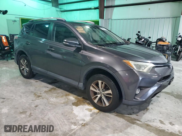 2016 Toyota RAV4 XLE with VIN 2T3RFREV3GW423028, listed as a Copart auction lot 63466735 with 164,207 mi miles and Salvage title. Bid and sale history available at DreamBid. Image 4.