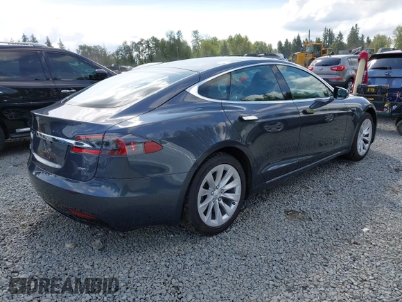 2017 Tesla Model S 100D with VIN 5YJSA1E27HF202563, listed as a IAAI auction lot 42460702 with 71,715 mi miles and . Bid and sale history available at DreamBid. Image 4.