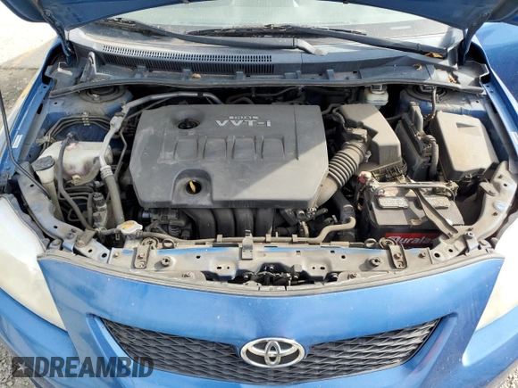 2010 Toyota Corolla z VIN 1NXBU4EE0AZ174665, wystawiony jako Copart lot #52187365 z przebiegiem 121 769 mil mil oraz Szkoda całkowita • Salvage title. Historia ofert i sprzedaży dostępna na DreamBid. Obrazek 11.