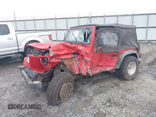 1997 Jeep Wrangler Sport z VIN 1J4FY19S2VP426553, wystawiony jako IAAI lot #41917764 z przebiegiem 154 140 mil mil oraz . Historia ofert i sprzedaży dostępna na DreamBid. Obrazek 2.