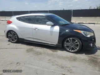 2014 Hyundai Veloster Turbo with VIN KMHTC6AE0EU192680, listed as a Copart auction lot 54486575 with 129,949 mi miles and Clean Title. Bid and sale history available at carsss.com. Image 4.