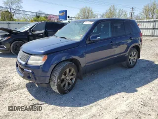 2012 Suzuki Grand Vitara z VIN JS3TD0D39C4100005, wystawiony jako Copart lot #51604055 z przebiegiem 179 490 mil mil oraz Szkoda całkowita • Salvage title. Historia ofert i sprzedaży dostępna na DreamBid. Obrazek 1.