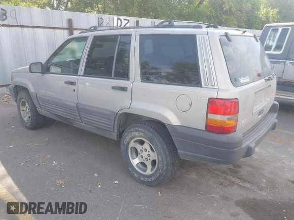 1998 Jeep Grand Cherokee Laredo with VIN 1J4GZ58S6WC319265, listed as a IAAI auction lot 42619853 with 238,667 mi miles and . Bid and sale history available at DreamBid. Image 3.