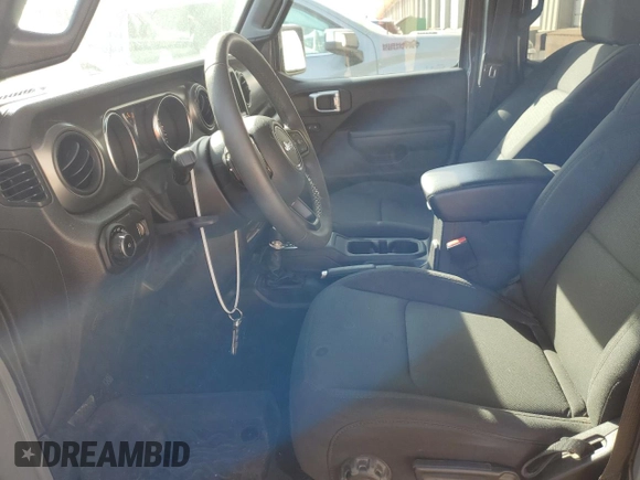 2023 Jeep Wrangler Sport S with VIN 1C4HJXDG8PW675134, listed as a Copart auction lot 85949314 with 19,128 mi miles and Salvage Title. Bid and sale history available at DreamBid. Image 7.