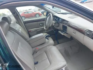 1999 Cadillac DeVille DHS with VIN 1G6KE54Y9XU766791, listed as a IAAI auction lot 42005553 with 140,515 mi miles. Bid and sale history available at carsss.com. Image 5.