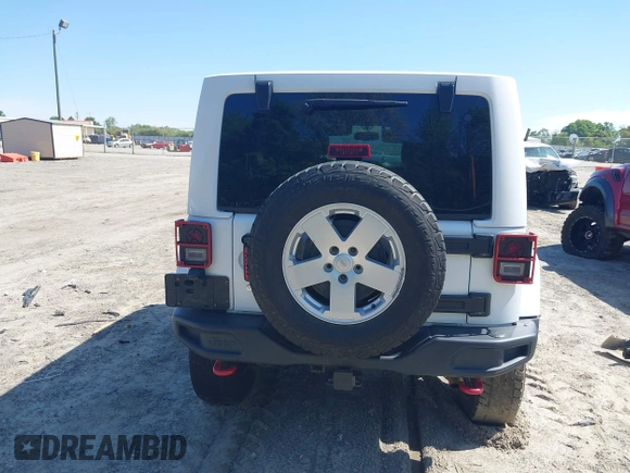 2017 Jeep Wrangler Unlimited Rubicon with VIN 1C4BJWFG9HL695361, listed as a IAAI auction lot 42010655 with 65,536 mi miles and . Bid and sale history available at DreamBid. Image 16.