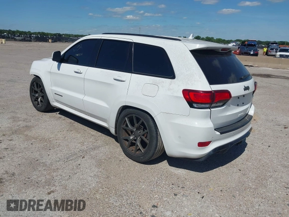 2020 Jeep Grand Cherokee Trackhawk with VIN 1C4RJFN96LC141513, listed as a IAAI auction lot 42386219 with Not provided miles and . Bid and sale history available at DreamBid. Image 3.