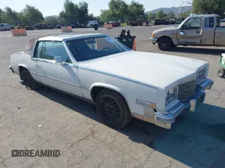 1985 Cadillac Eldorado z VIN 1G6EL5786FE637155, wystawiony jako IAAI lot #41855514 z przebiegiem 71 863 mil mil oraz . Historia ofert i sprzedaży dostępna na DreamBid. Obrazek 1.