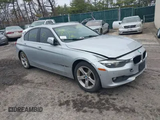 2015 BMW 3 Series 328i xDrive with VIN WBA3B5G57FNS12490, listed as a IAAI auction lot 41927689 with 999,999 mi miles. Bid and sale history available at carsss.com. Image 1.