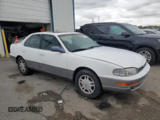 1994 Toyota Camry XLE with VIN JT2GK13E5R0008509, listed as a Copart auction lot 76014164 with 188,427 mi miles and Salvage Title. Bid and sale history available at carsss.com. Image 4.