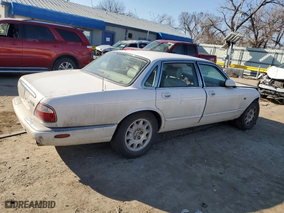 2001 Jaguar XJ with VIN SAJDA14CX1LF29825, listed as a Copart auction lot 42064715 with 127,389 mi miles and Salvage Title. Bid and sale history available at carsss.com. Image 3.
