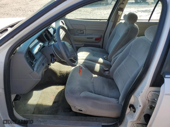 2000 Ford Crown Victoria LX with VIN 2FAFP74W0YX125595, listed as a Copart auction lot 84675434 with 151,438 mi miles and Salvage Title. Bid and sale history available at carsss.com. Image 7.
