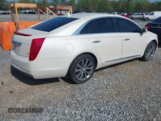 2014 Cadillac XTS with VIN 2G61L5S3XE9231858, listed as a IAAI auction lot 41941564 with 158,479 mi miles. Bid and sale history available at carsss.com. Image 4.
