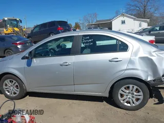 2018 Chevrolet Sonic LS with VIN 1G1JB5SH2J4112817, listed as a IAAI auction lot 41620486 with 60,479 mi miles and . Bid and sale history available at DreamBid. Image 14.