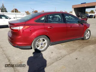 2014 Ford Focus SE with VIN 1FADP3F20EL340123, listed as a Copart auction lot 77626984 with 69,487 mi miles and Salvage Title. Bid and sale history available at DreamBid. Image 3.