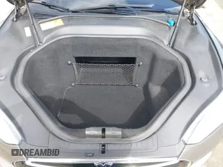 2015 Tesla Model S 85 with VIN 5YJSA1E14FF120455, listed as a IAAI auction lot 42053306 with 62,817 mi miles and . Bid and sale history available at DreamBid. Image 10.