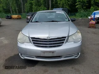2010 Chrysler Sebring Touring z VIN 1C3CC4FB3AN203543, wystawiony jako Copart lot #57767985 z przebiegiem 152 951 mil mil oraz Szkoda całkowita • Salvage title. Historia ofert i sprzedaży dostępna na DreamBid. Obrazek 5.