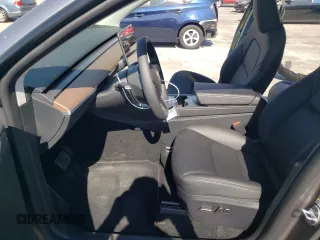 2024 Tesla Model Y Long Range с VIN 7SAYGAEE6RF131749, выставлен на аукционе Copart как лот 74548014 с пробегом 1 042 миль миль и Списание • Salvage title. История ставок и продаж доступна на DreamBid. Изображение 7.
